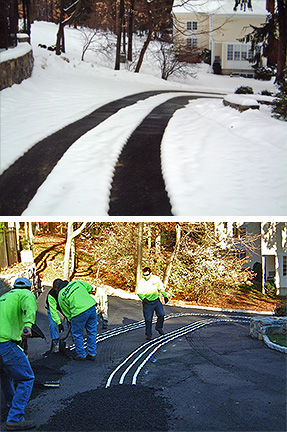 A snow melting system with heated tire tracks being installed.